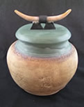 clay pot with horns on lid